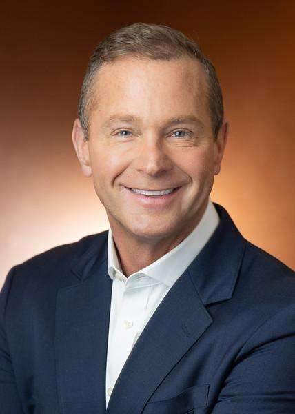 Dr. Jason Ingham, DC, CCSP, smiling chiropractor at DRX Chicago, specializing in non-invasive spinal decompression therapy.